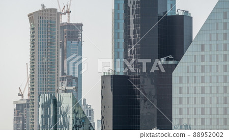High multi-storey buildings under construction and cranes timelapse High multi-storey buildings under construction and cranes timelapse 88952002