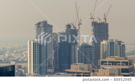 High multi-storey buildings under construction and cranes timelapse High multi-storey buildings under construction and cranes timelapse 88952095