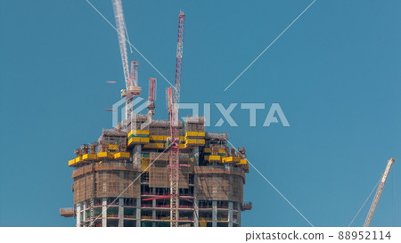 High multi-storey building under construction and cranes timelapse High multi-storey building under construction and cranes timelapse 88952114