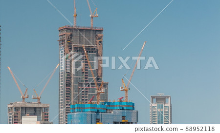 High multi-storey buildings under construction and cranes timelapse High multi-storey buildings under construction and cranes timelapse 88952118