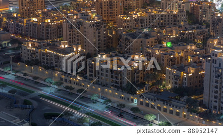 Aerial view to traditional houses of old town island night timelapse from above. Aerial view to traditional houses of old town island night timelapse from above. 88952147