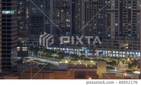 Big glowing windows in modern office and residential buildings timelapse at night Big glowing windows in modern office and residential buildings timelapse at night 88952176