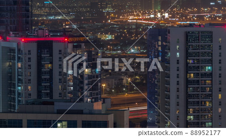 Dubai's business bay towers aerial night timelapse. Rooftop view of some skyscrapers Dubai's business bay towers aerial night timelapse. Rooftop view of some skyscrapers 88952177