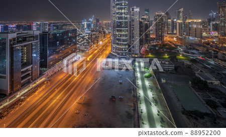Dubai's business bay towers aerial night timelapse. Rooftop view of some skyscrapers 88952200