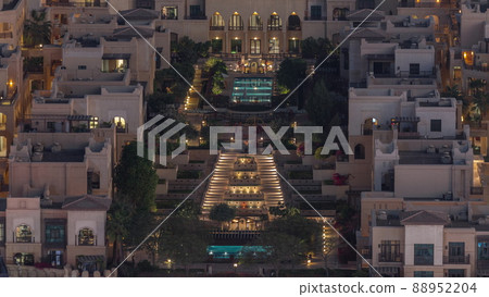 Aerial view to traditional houses of old town island night timelapse from above. 88952204