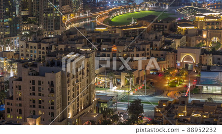 Aerial view to traditional houses of old town island night timelapse from above. Aerial view to traditional houses of old town island night timelapse from above. 88952232