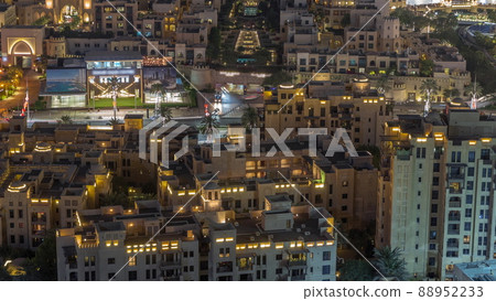 Aerial view to traditional houses of old town island night timelapse from above. Aerial view to traditional houses of old town island night timelapse from above. 88952233