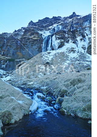 Icelandic waterfall, snowy landscape of Seljalandsfoss 88952321