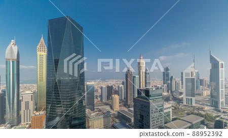 Panorama of futuristic skyscrapers in financial district business center in Dubai on Sheikh Zayed road timelapse Panorama of futuristic skyscrapers in financial district business center in Dubai on Sheikh Zayed road timelapse 88952392