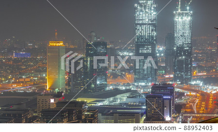Aerial view of skyscrapers with World Trade center in Dubai all night timelapse. 88952403