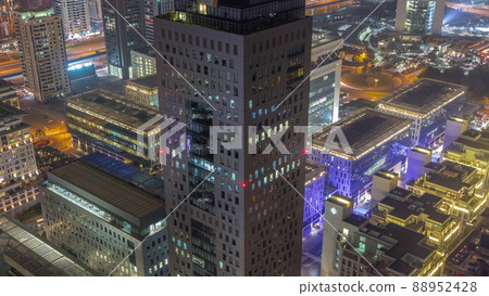 Office tower located in the Dubai International Financial Centre night timelapse Office tower located in the Dubai International Financial Centre night timelapse 88952428