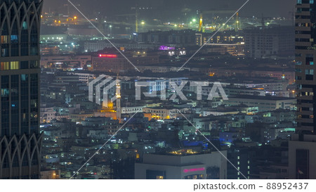 Aerial view of apartment houses and villas in Dubai city night timelapse, United Arab Emirates 88952437
