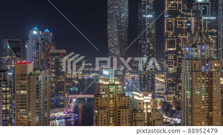Skyscrapers of Dubai Marina near intersection on Sheikh Zayed Road with highest residential buildings night timelapse Skyscrapers of Dubai Marina near intersection on Sheikh Zayed Road with highest residential buildings night timelapse 88952479