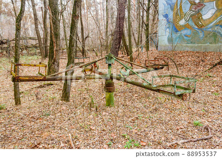 Abandoned children's playground in the ghost town Pripyat in Chernobyl Exclusion Zone, Ukraine 88953537