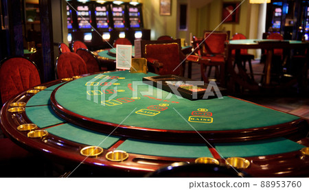 An empty blackjack table in a casino in green tones An empty blackjack table in a casino in green tones 88953760