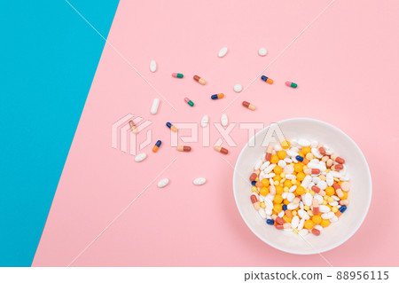 Pharmaceutical Industry and Medicinal Products - Colored Pills in White Dish Pharmaceutical Industry and Medicinal Products - Colored Pills in White Dish 88956115