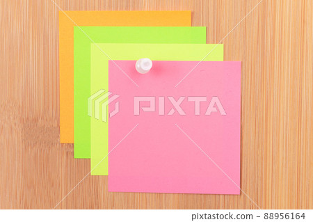 Colored Sticky Notes Pinned to the Wooden Message Board Colored Sticky Notes Pinned to the Wooden Message Board 88956164