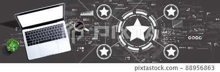 Rating star concept with a laptop computer Rating star concept with a laptop computer 88956863