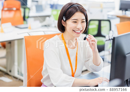 Young woman working in a call center 88957166