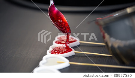 Close-up, the process of making lollipops from natural ingredients. Close-up, the process of making lollipops from natural ingredients. 88957580