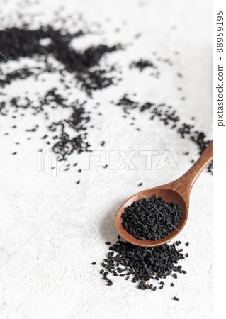 Wooden spoon of Indian spice Black cumin (nigella sativa or kalonji) seeds close up Wooden spoon of Indian spice Black cumin (nigella sativa or kalonji) seeds close up 88959195