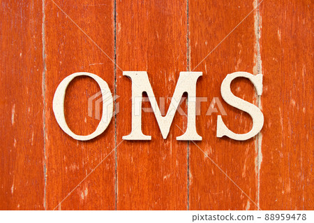Alphabet letter in word OMS (Abbreviation of Order management system or Operations management system) on old red color wood plate background Alphabet letter in word OMS (Abbreviation of Order management system or Operations management system) on old red color wood plate background 88959478