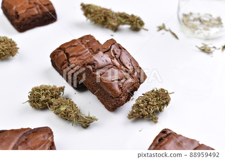 Cannabis brownies, cannabis flowers on white table for home consumption and recreational medicinal  88959492