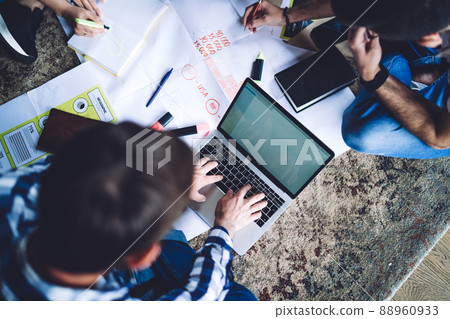 Skilled male searching information on laptop technology while collaborating with remote colleagues Skilled male searching information on laptop technology while collaborating with remote colleagues 88960933