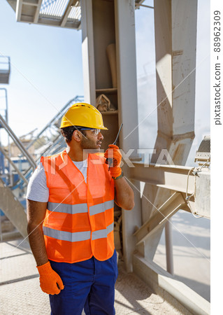 Construction industrial engineer with walkie-talkie at plant Construction industrial engineer with walkie-talkie at plant 88962309