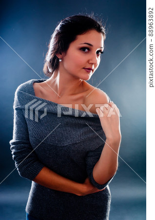 Portrait of young pretty woman in sweater Portrait of young pretty woman in sweater 88963892