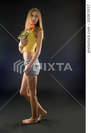 Pretty girl with flower 88963917