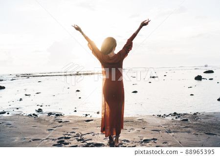 Unrecognizable woman with hands up Unrecognizable woman with hands up 88965395