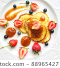 Pancakes decorated with berries, strawberries, raspberries, blueberries and sauce 88965427