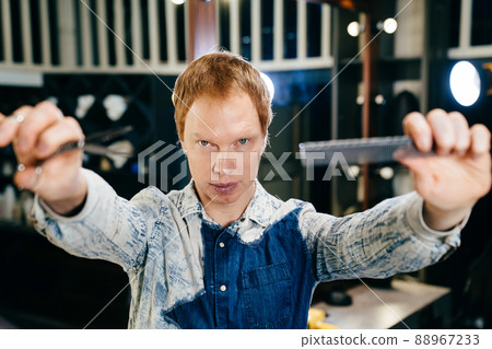 male hairdresser and stylist barbershop worker with scissors and comb 88967233
