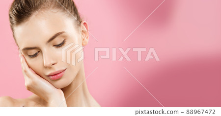 Beauty skin Concept - Beautiful Young Caucasian Woman with Clean Fresh Skin look away with pink studio background. Girl beauty face care. Facial treatment. Cosmetology , beauty and spa. Beauty skin Concept - Beautiful Young Caucasian Woman with Clean Fresh Skin look away with pink studio background. Girl beauty face care. Facial treatment. Cosmetology , beauty and spa. 88967472
