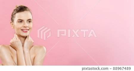 Beauty Concept - Beautiful Caucasian woman with clean skin, natural make-up isolated on bright pink background with copy space. 88967489