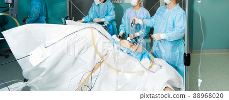 A team of surgeons perform laparoscopic surgery in the operating room. A team of surgeons perform laparoscopic surgery in the operating room. 88968020