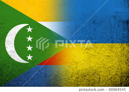 The Union of the Comoros National flag with National flag of Ukraine. Grunge background 88969545