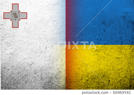 The Republic of Malta National flag with National flag of Ukraine. Grunge background 88969592