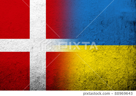 the Kingdom of Denmark National flag with National flag of Ukraine. Grunge background the Kingdom of Denmark National flag with National flag of Ukraine. Grunge background 88969643