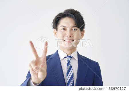 Businessman Peace Sign White background 88970127