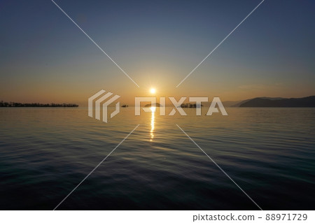 Sunset scene of Lake Biwa sinking over Chikubu Island @ Shiga Sunset scene of Lake Biwa sinking over Chikubu Island @ Shiga 88971729