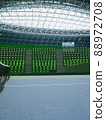 Unmanned tennis courts and spectators' seats in the arena 88972708