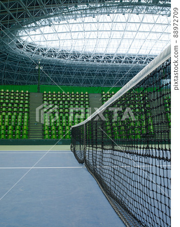 Unmanned tennis courts and spectators' seats in the arena Unmanned tennis courts and spectators' seats in the arena 88972709