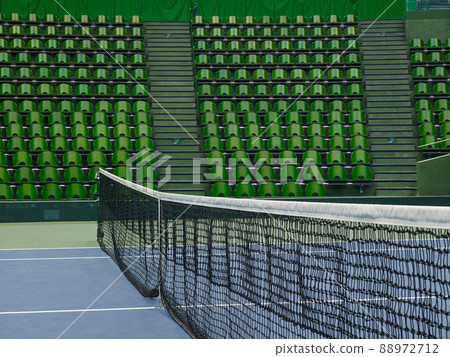 Unmanned tennis courts and spectators' seats in the arena 88972712