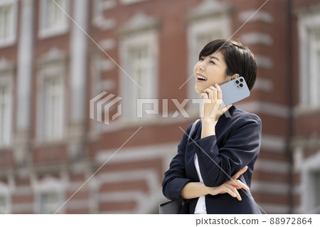 Businesswoman talking on a smartphone Businesswoman talking on a smartphone 88972864
