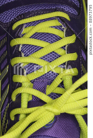 Purple and Yellow Athletic Shoe Close up 88973795