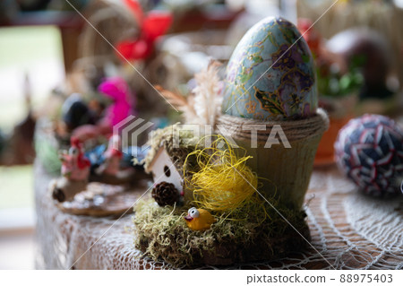 A chickadee sits in a nest. Easter decoration for your home. 88975403