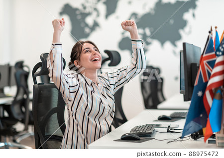 Portrait of young excited multiethnics business team of software developers standing and looking at camera at modern startup office Portrait of young excited multiethnics business team of software developers standing and looking at camera at modern startup office 88975472