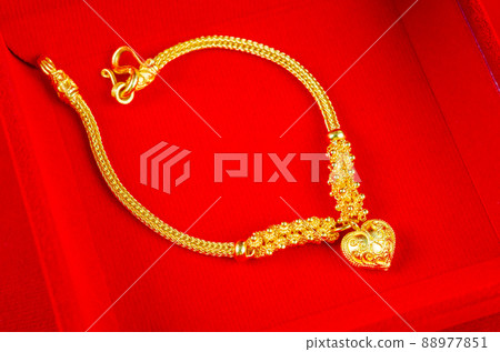 Gold Bracelet in red velvet box container. 88977851